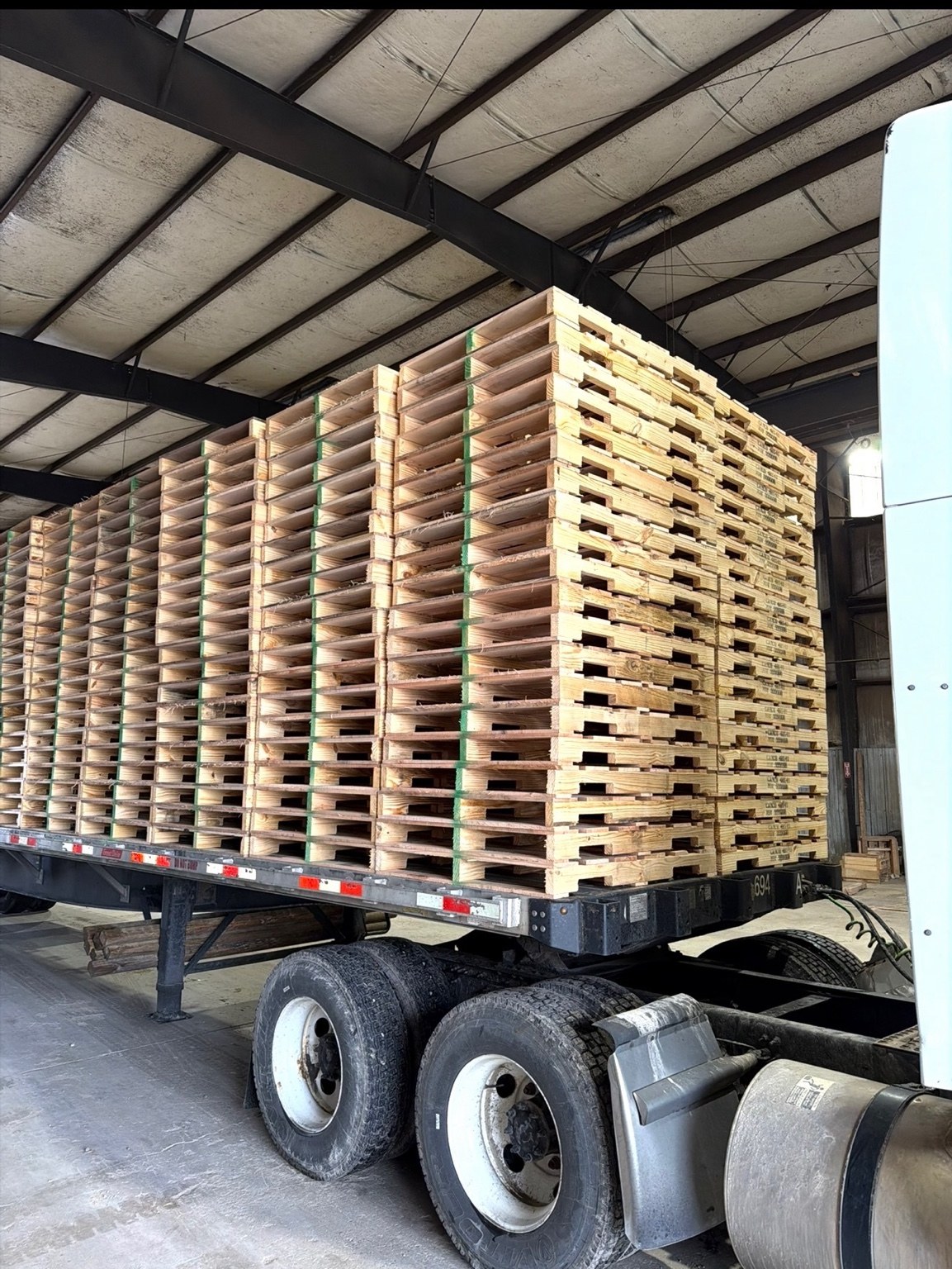 Company truck and trailer loaded with a large pallet order