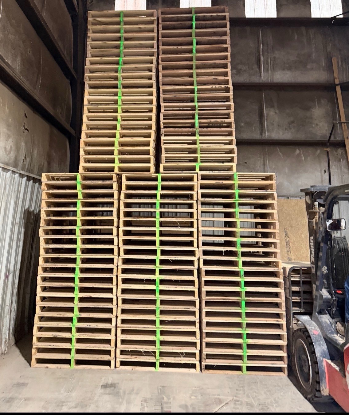 Large stacks of custom pallets prepared for shipment